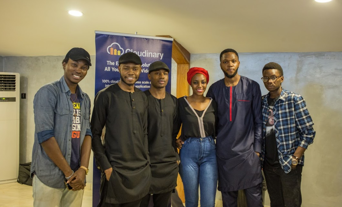 A cross section of the participants posing with Codebeast and the Cloudinary banner.